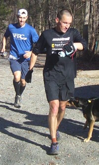 Sean Andrish leads Mike Schuster to the finish line