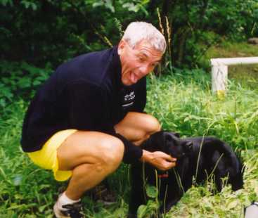 Chris Scott and Gary Knipling's dog, Major, amuse themselves at Pitt Spring during the 2001 Catherine's Fat Ass